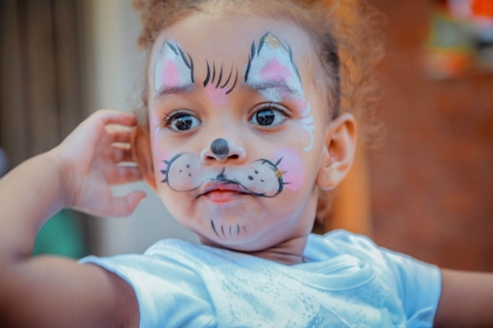 toddler with facepaint and speech delay